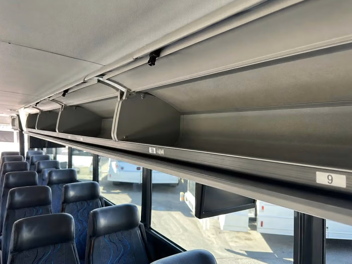 paragould 56 passenger charter bus overhead storage
